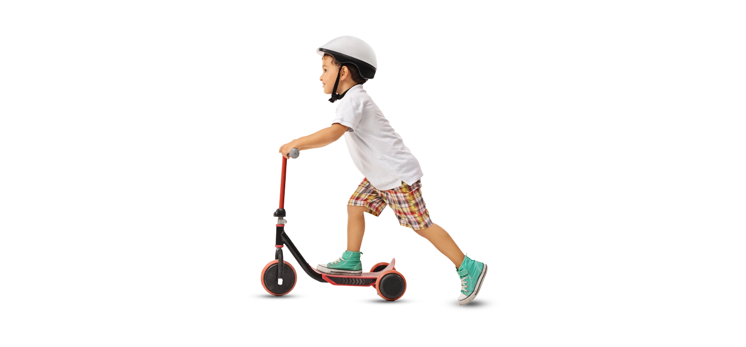 boy riding a children's scooter, wearing a helmet
