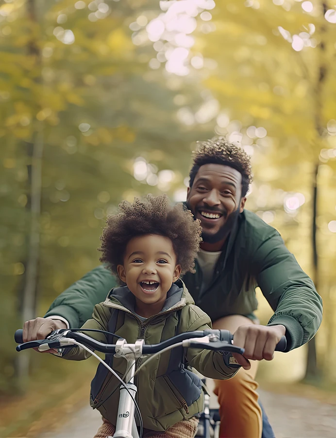father and son riding a bicycle