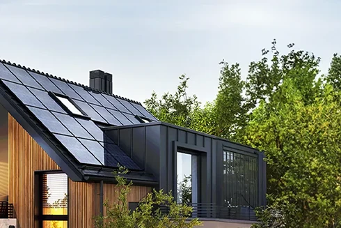 house with solar panels, surrounded by trees