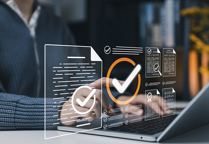 Validating digital documents on a laptop with compliance icons