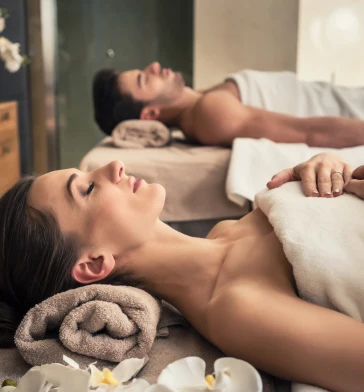 couple lying down, relaxed, during a spa treatment