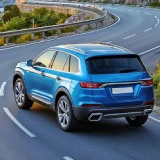 Car traveling on a road by the sea