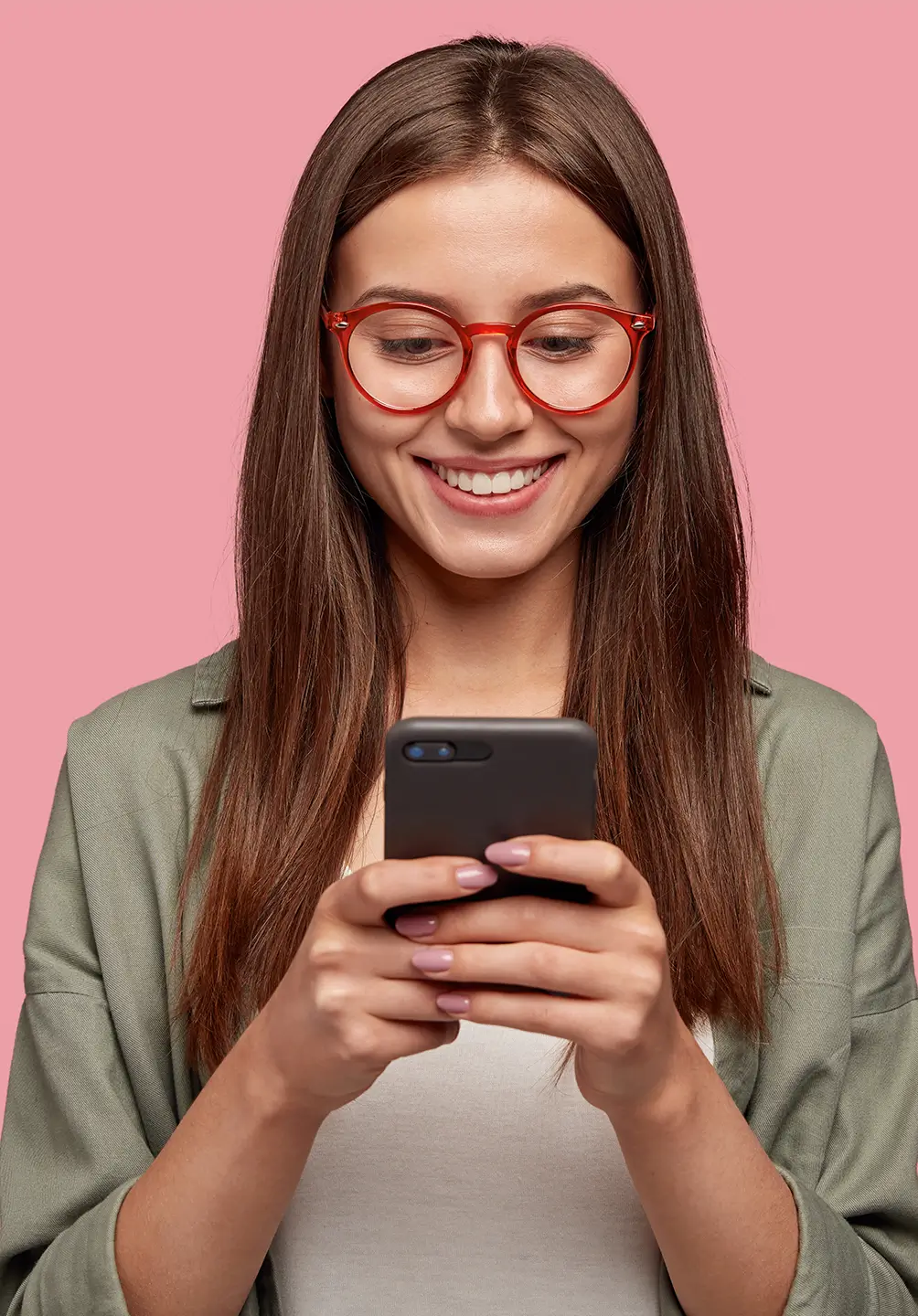 young girl checking her phone and smiling