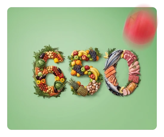 O número 650 formado por diferentes tipos de alimentos sobre um fundo verde