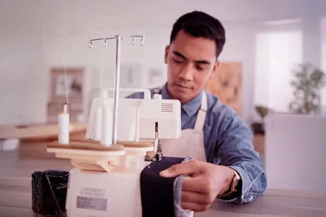 Man working at an industrial sewing machine