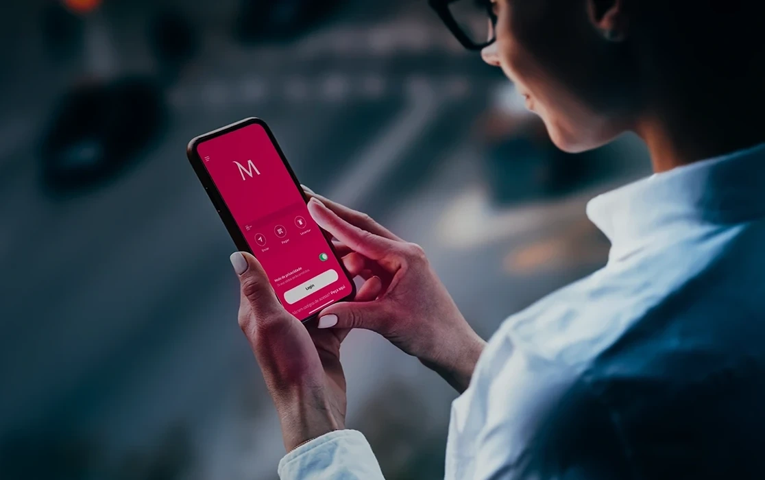 Person using the Millennium App on a smartphone