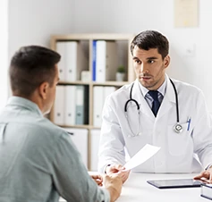 doctor talking to a patient in a medical office