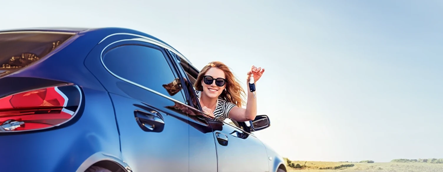 woman in sunglasses, looking out ou car window, holding keys