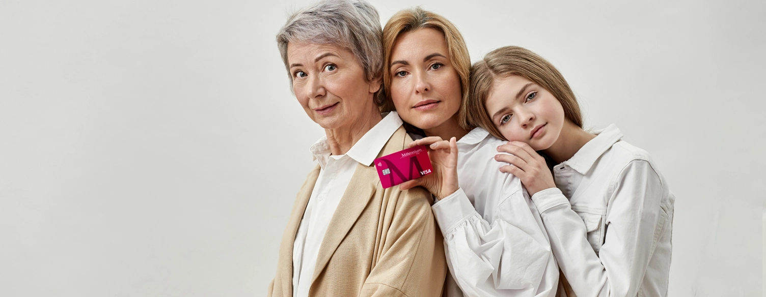 grandmother, mother, and daughter, leaning against each other, with a Classic card in hand