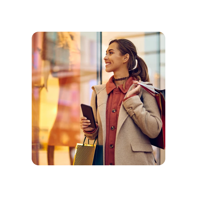 woman holding shopping bags