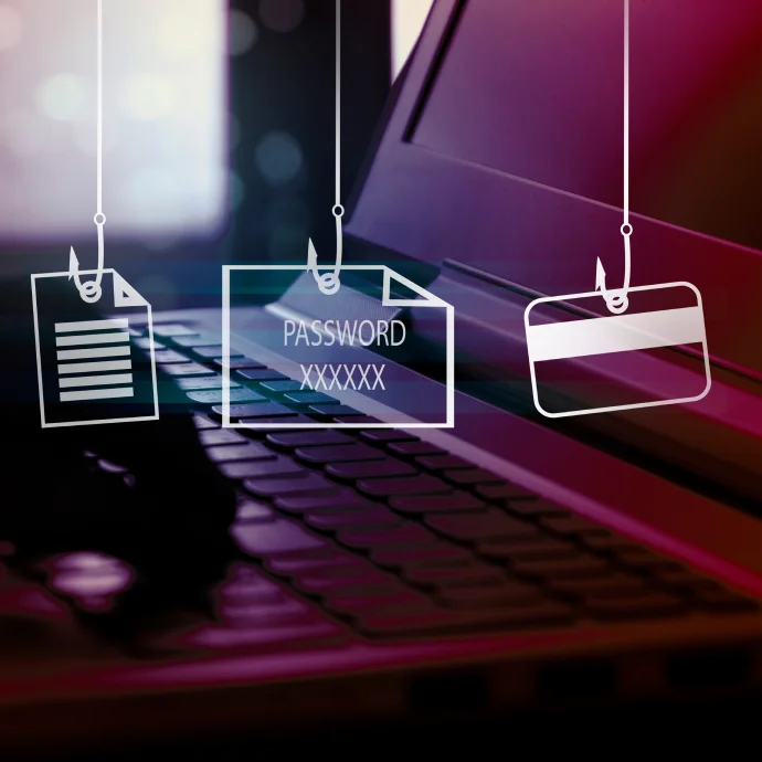 Ilustração de ataque de phishing sobre um teclado de computador, com ícones suspensos de documentos, palavra-passe e cartão de pagamento