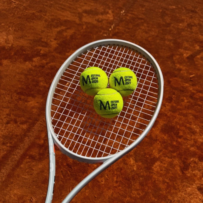 Tennis racket with three Millennium Estoril Open balls on top of the net