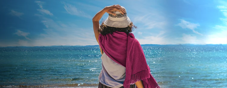 woman on the beach, walking towards the sea