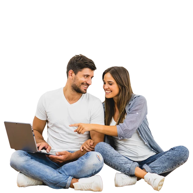 couple sitting cross-legged with a laptop