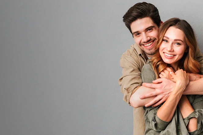 Young smiling couple, hugging