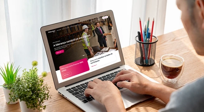 Person browsing the Millennium business website on a laptop