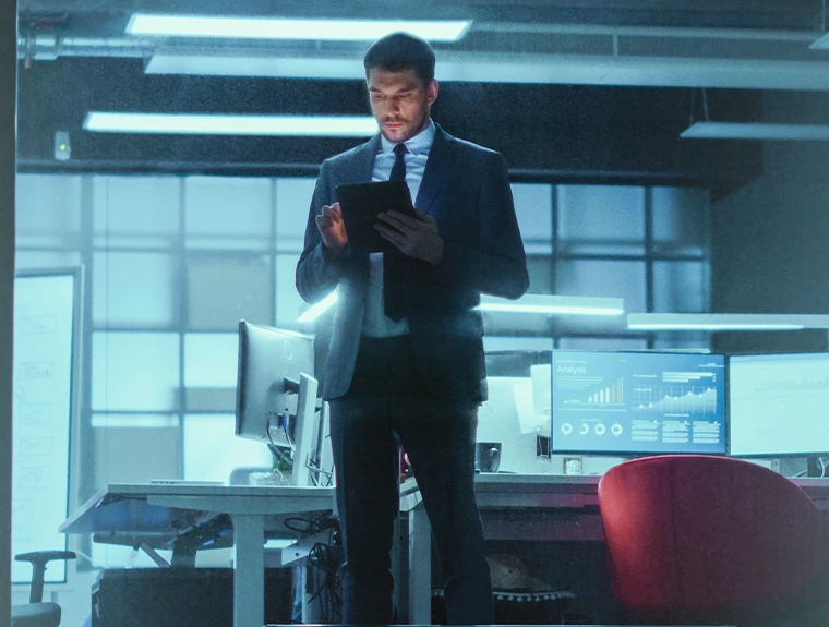 businessman, standing in office, with tablet