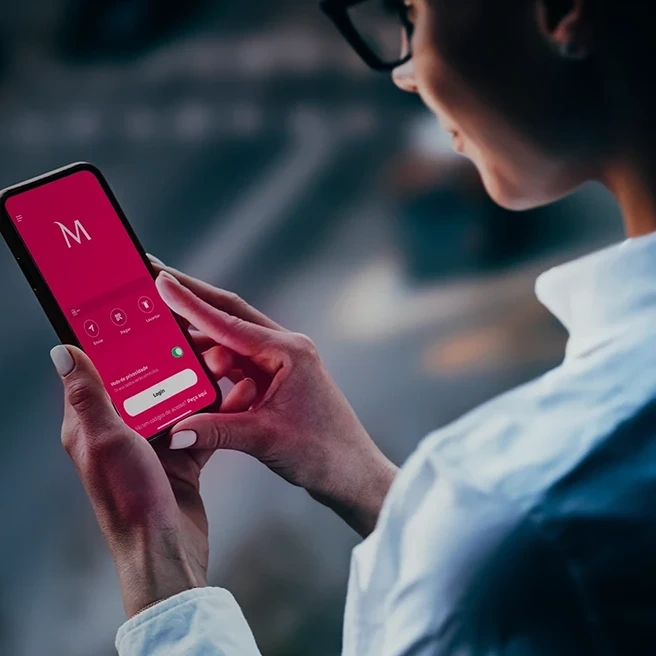 Person using the Millennium App on a smartphone