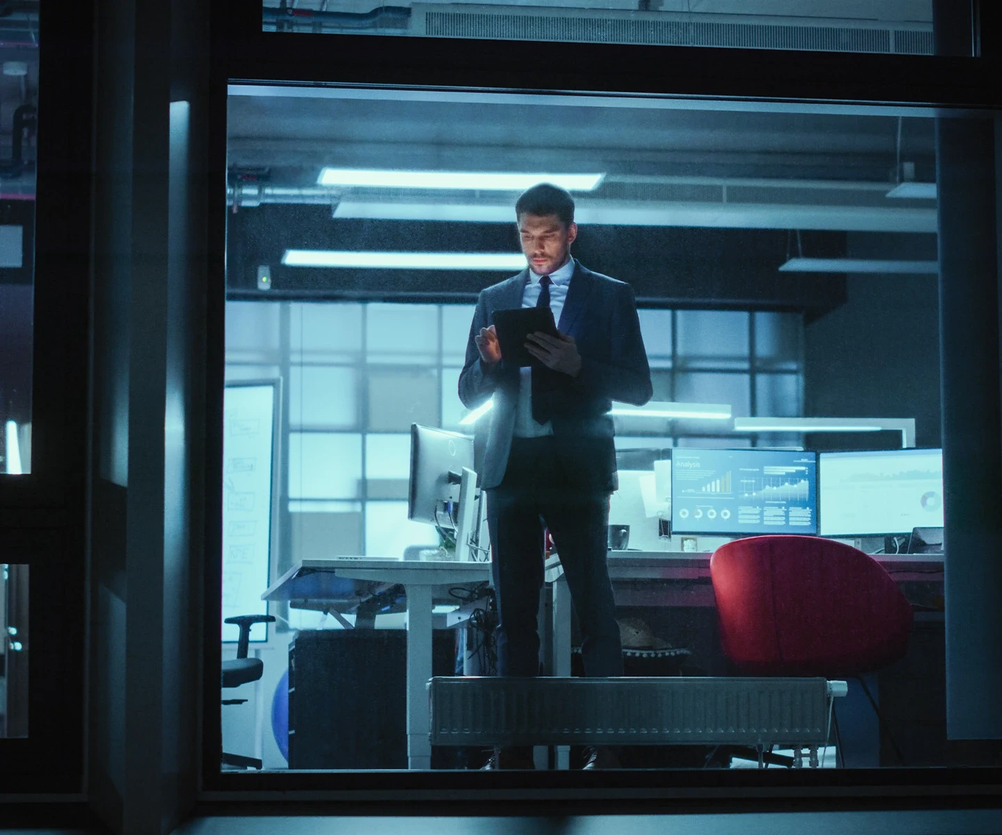 businessman, standing in office, with tablet