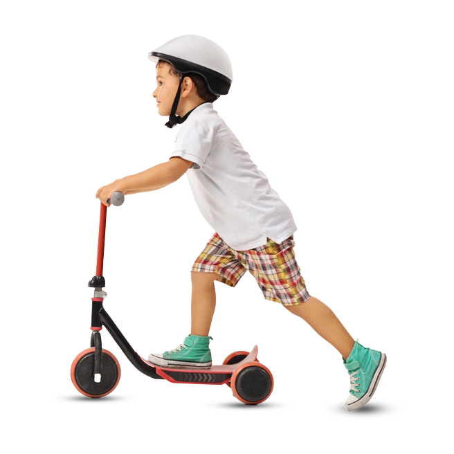 boy riding a children's scooter, wearing a helmet